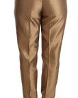 Dolce & Gabbana Elegant Tapered Silk Trousers in Gold
